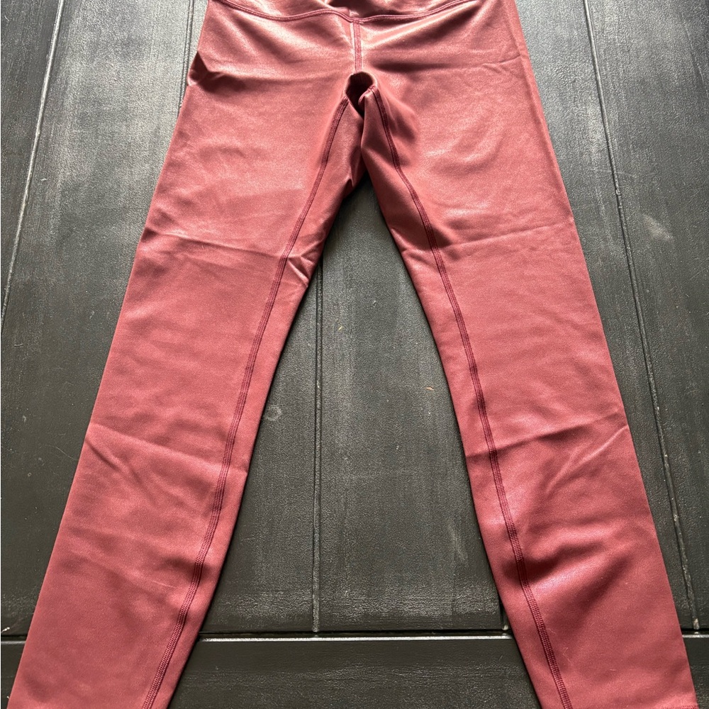 Lululemon, shiny burgundy/red leggings. Worn a few times. Size 6.